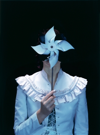 Sophie Delaporte, Early Fashion Work, Model holding handheld paper windmill before face, Sous Les Etoiles Gallery